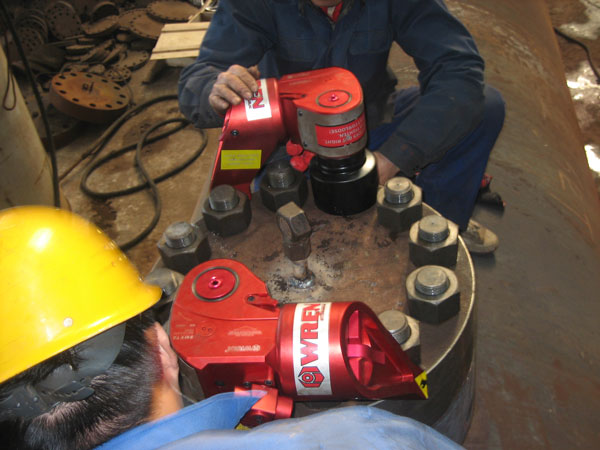 Two IBT Series Square drive hydraulic torque wrench in use